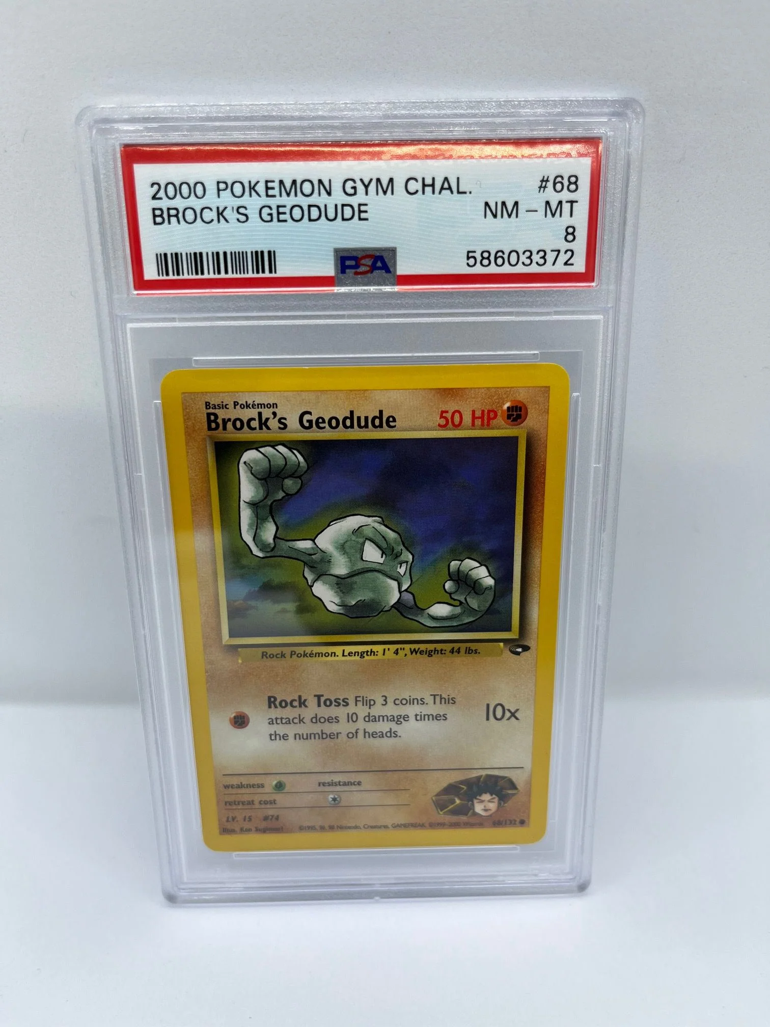 Brock's Geodude 68/132 PSA 8 Graded Common Pokemon Card (2000 Pokemon Gym Chal)